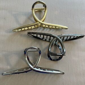 Elegant Gold and Silver Hair Clips with Sculptural Design